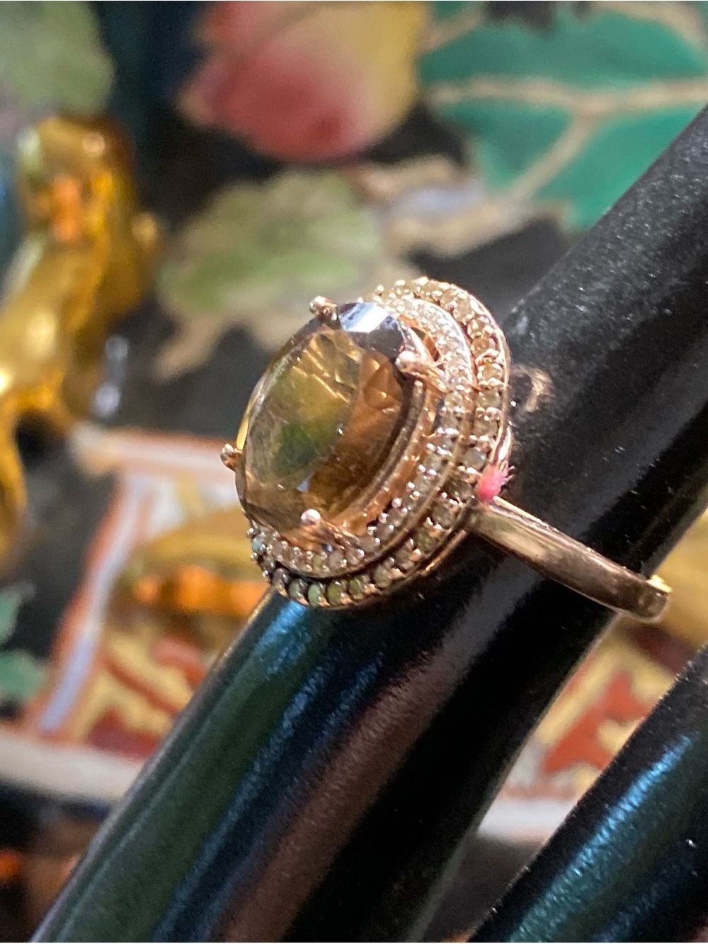 14K Gold Ring with Brown gemstone and diamonds.
